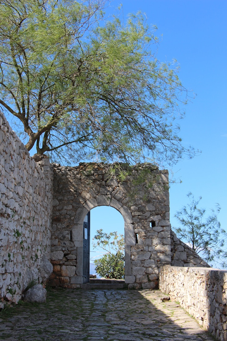 entrance to nafplio palamidi fortress shadows trees