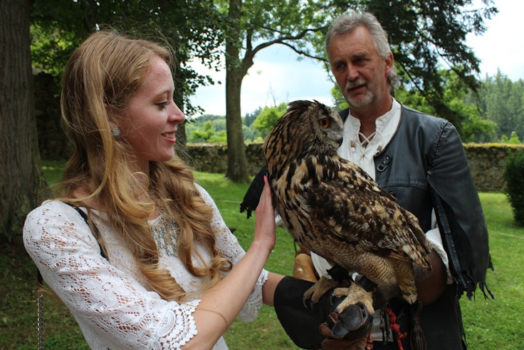 girl holding an owl