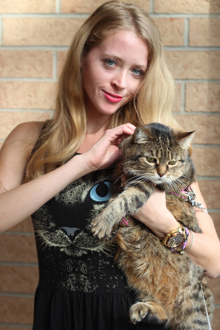 girl with fat tabby cat