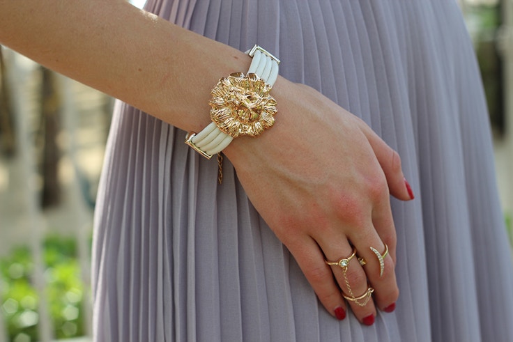 gold lion bracelet and rings