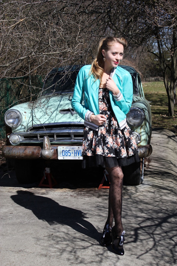vintage car girl in 50s outfit