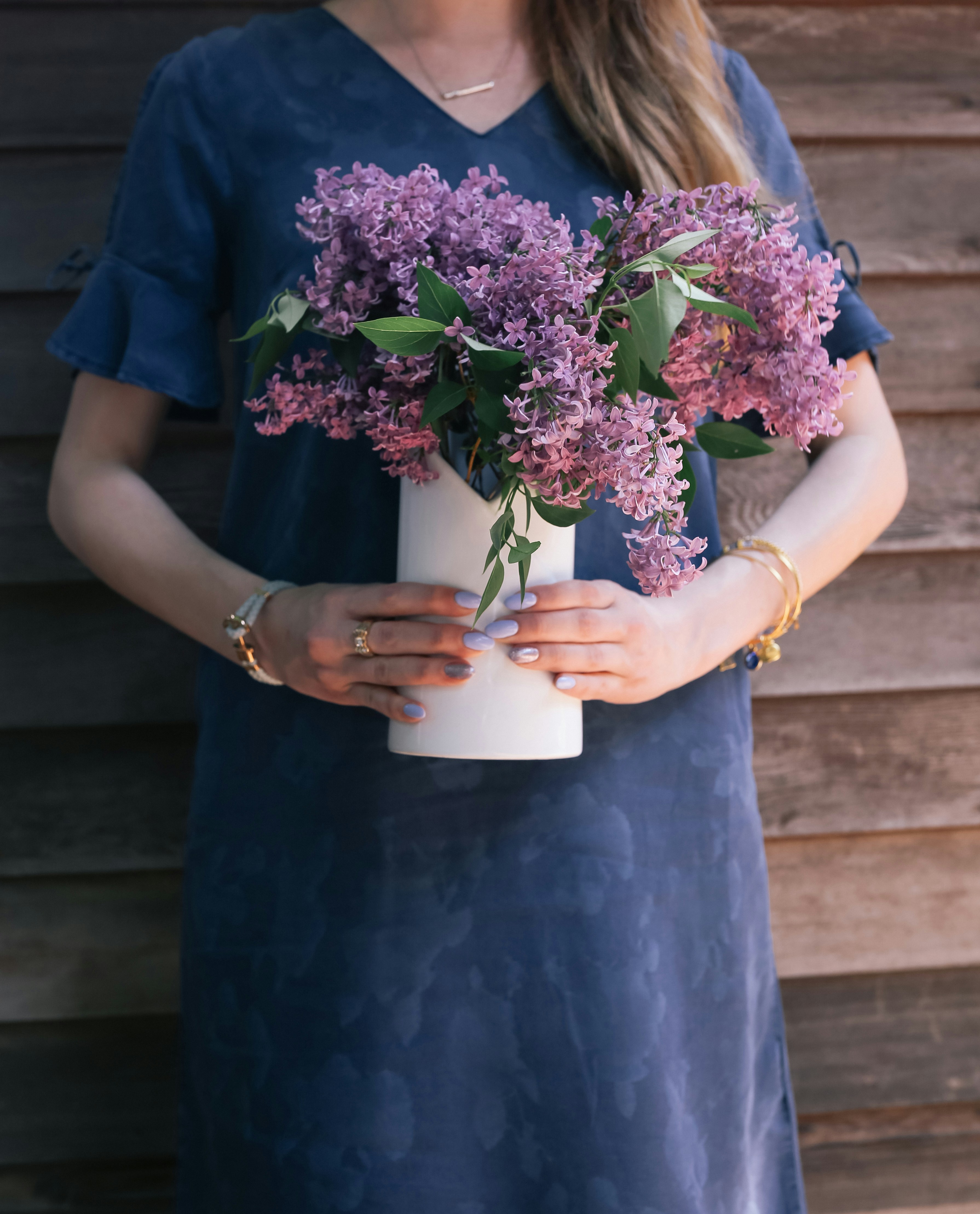 denim dress and lilac bouquet