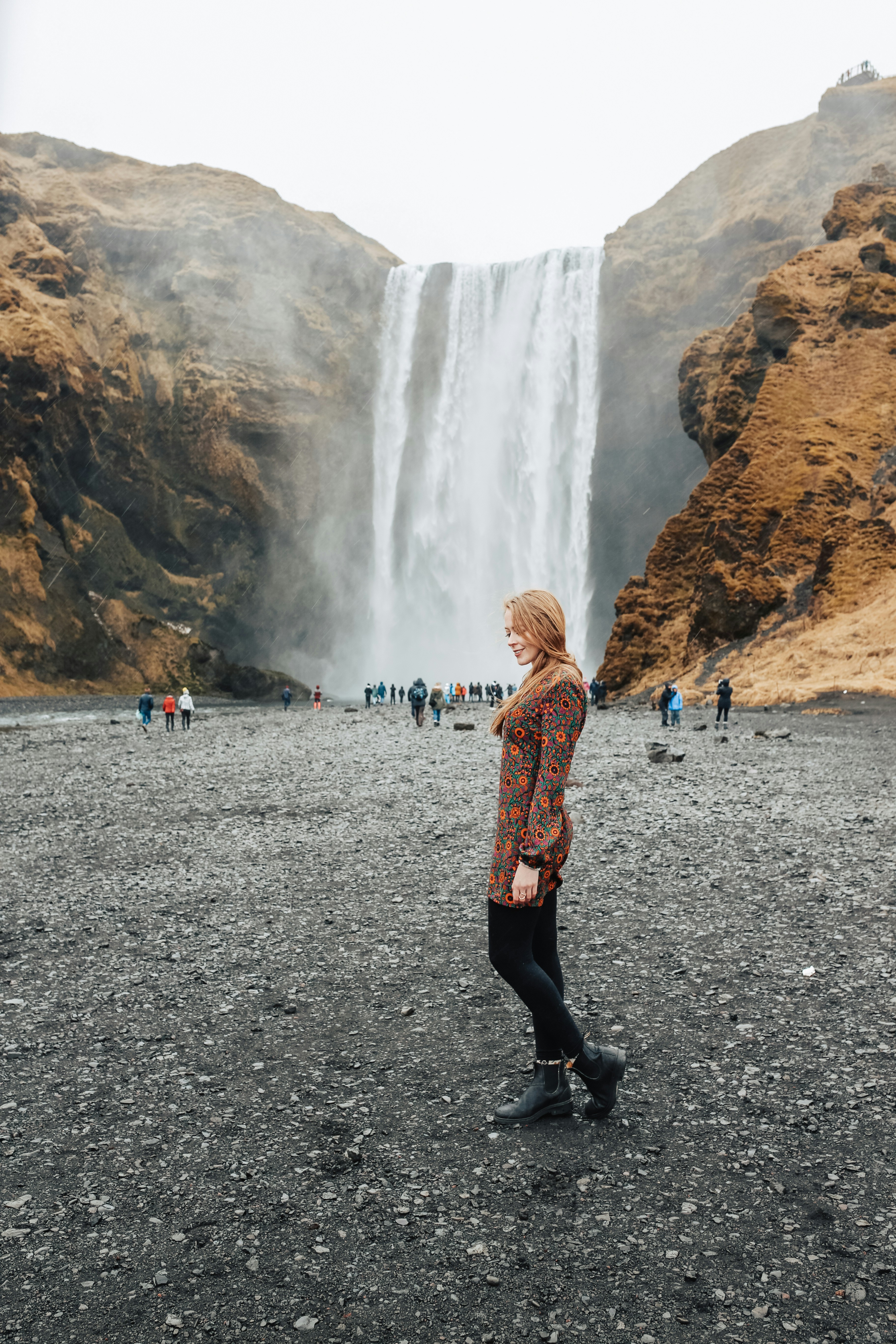 Southern Iceland Vik Travel Itinerary: I wore this floral printed dress that has a retro-Nordic flair. Skógafoss is such a stunning backdrop for photos.