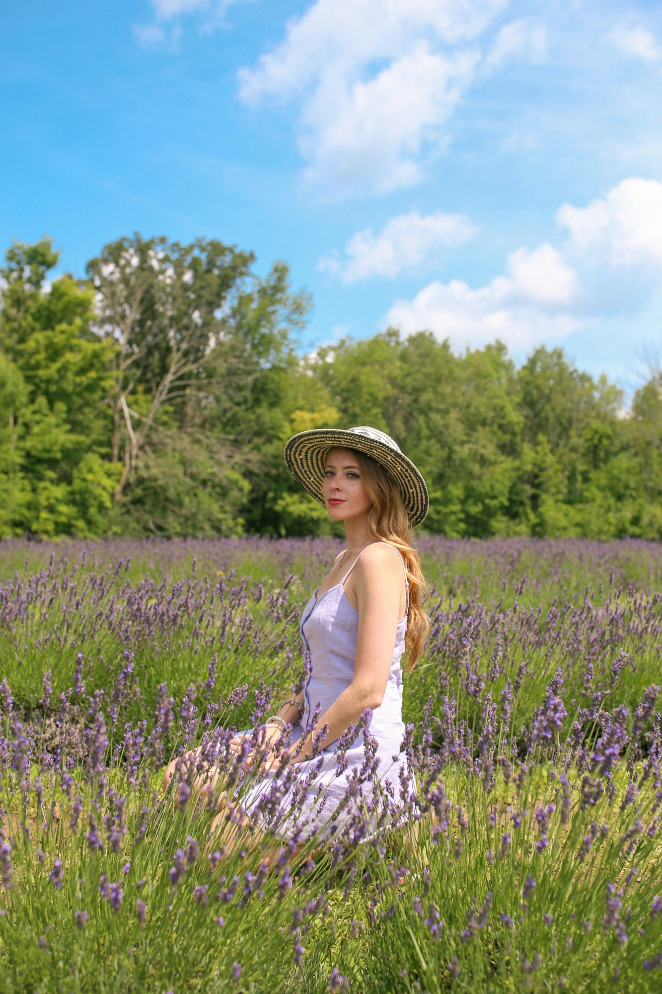 Straw hat and purple linen dress from Urban Outfitters | What to wear to a Lavender field - stay cool in a light linen dress and sunhat.