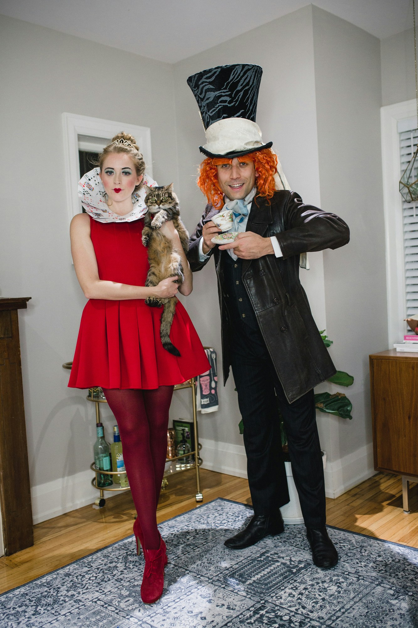 Alice in Wonderland couples halloween costume: Mad Hatter, Queen of Hearts and the Cheshire Cat