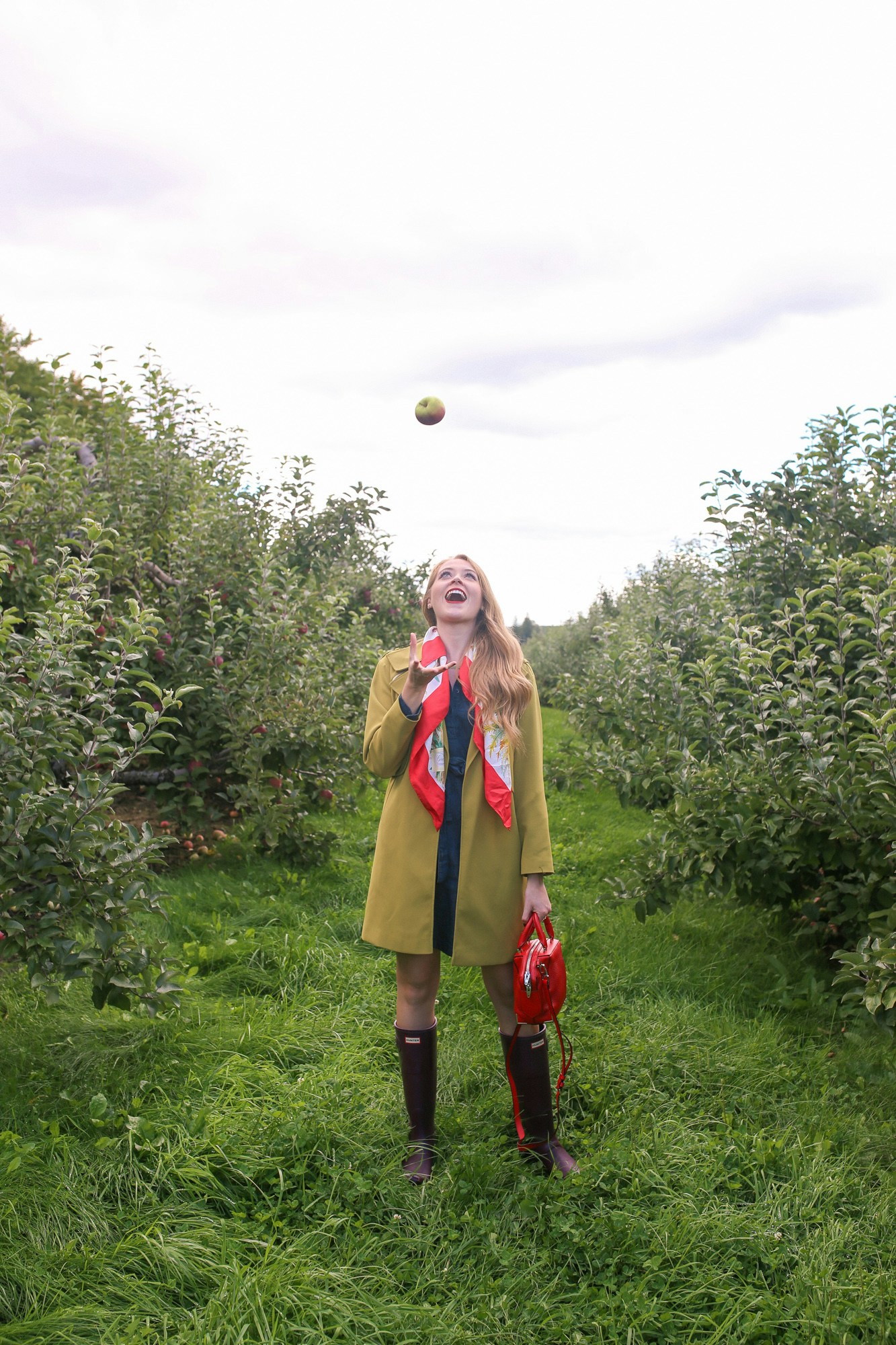 Apple picking near Toronto: Applewood Farm Winery. I wore a chartreuse trench and silk scarf and Hunter Boots for a chic, practical fall outfit.