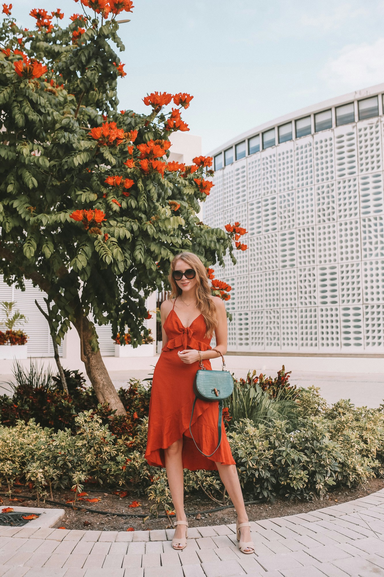 What to wear in the Mayan Riviera? I'm sharing this orange linen dress and statement accessories as outfit inspiration, as well as a packing list for a chic resort wear wardrobe that's perfect for visiting Mexico in winter!
