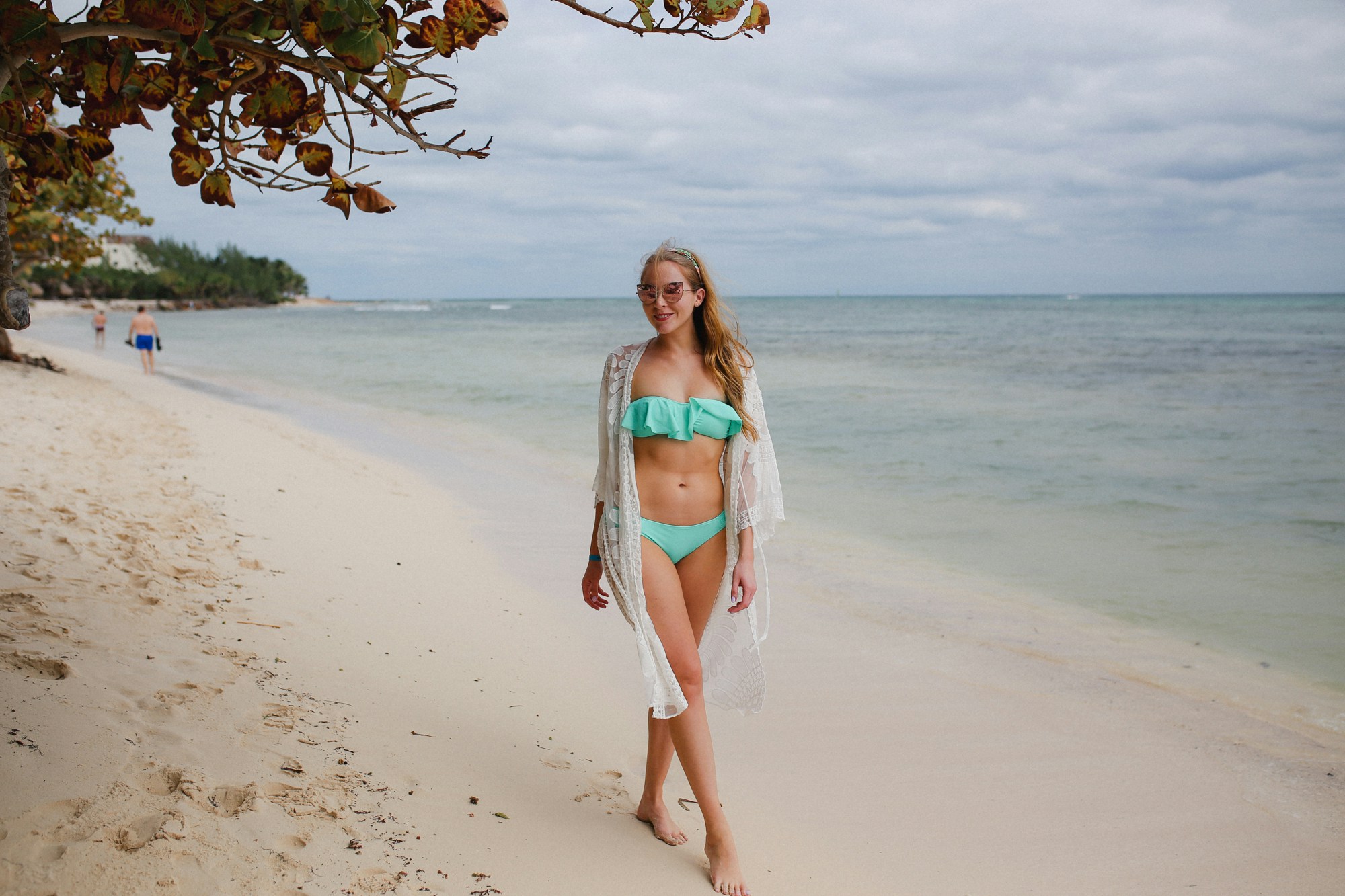 Aqua Victoria's Secret bathing suit and white lace Amazon coverup.