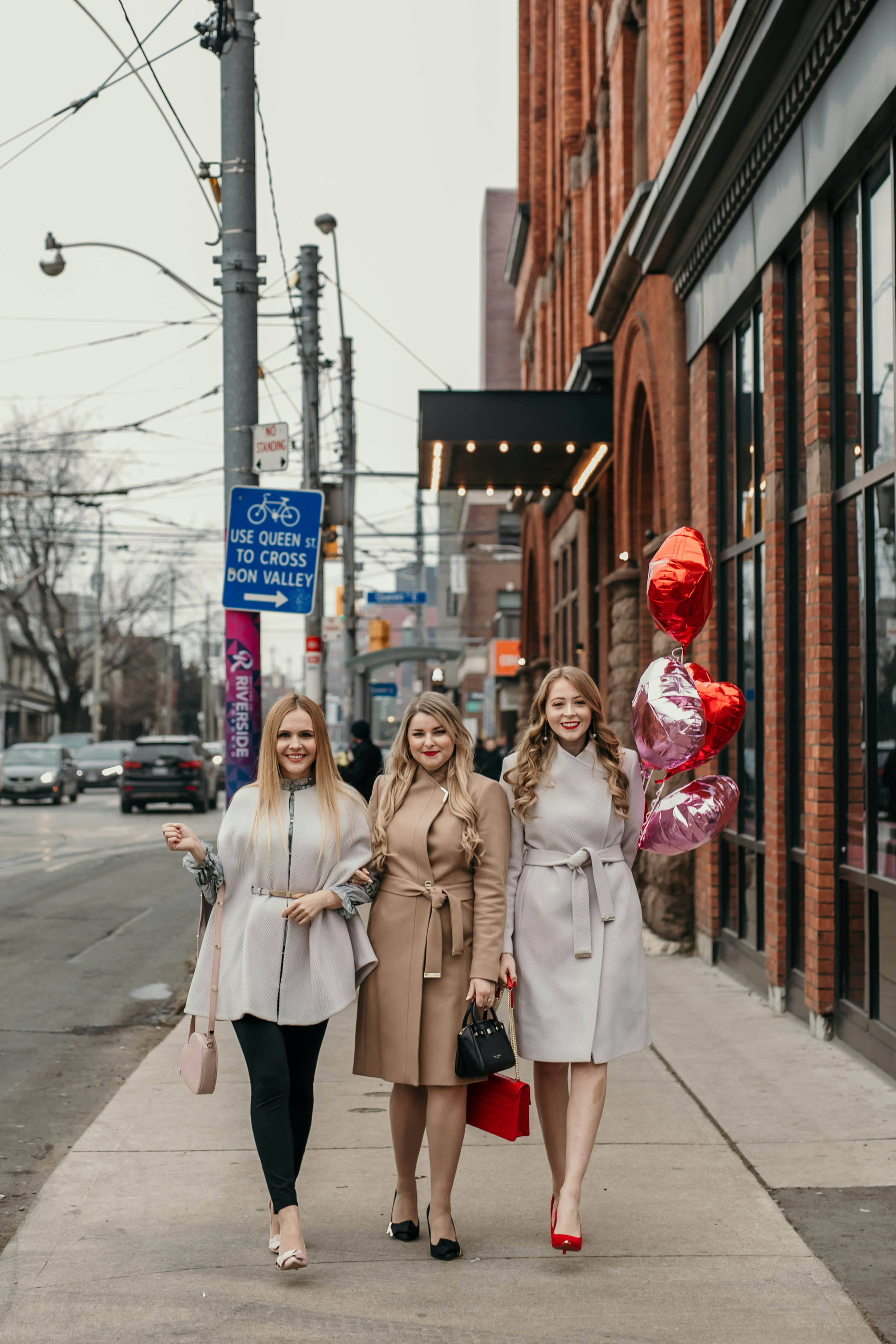 Valentine's Day Outfit Ideas: in february, grab a chic Ted Baker wool wrap coat, red pumps, a chic handbag and fun dress for an elegant festive look.
