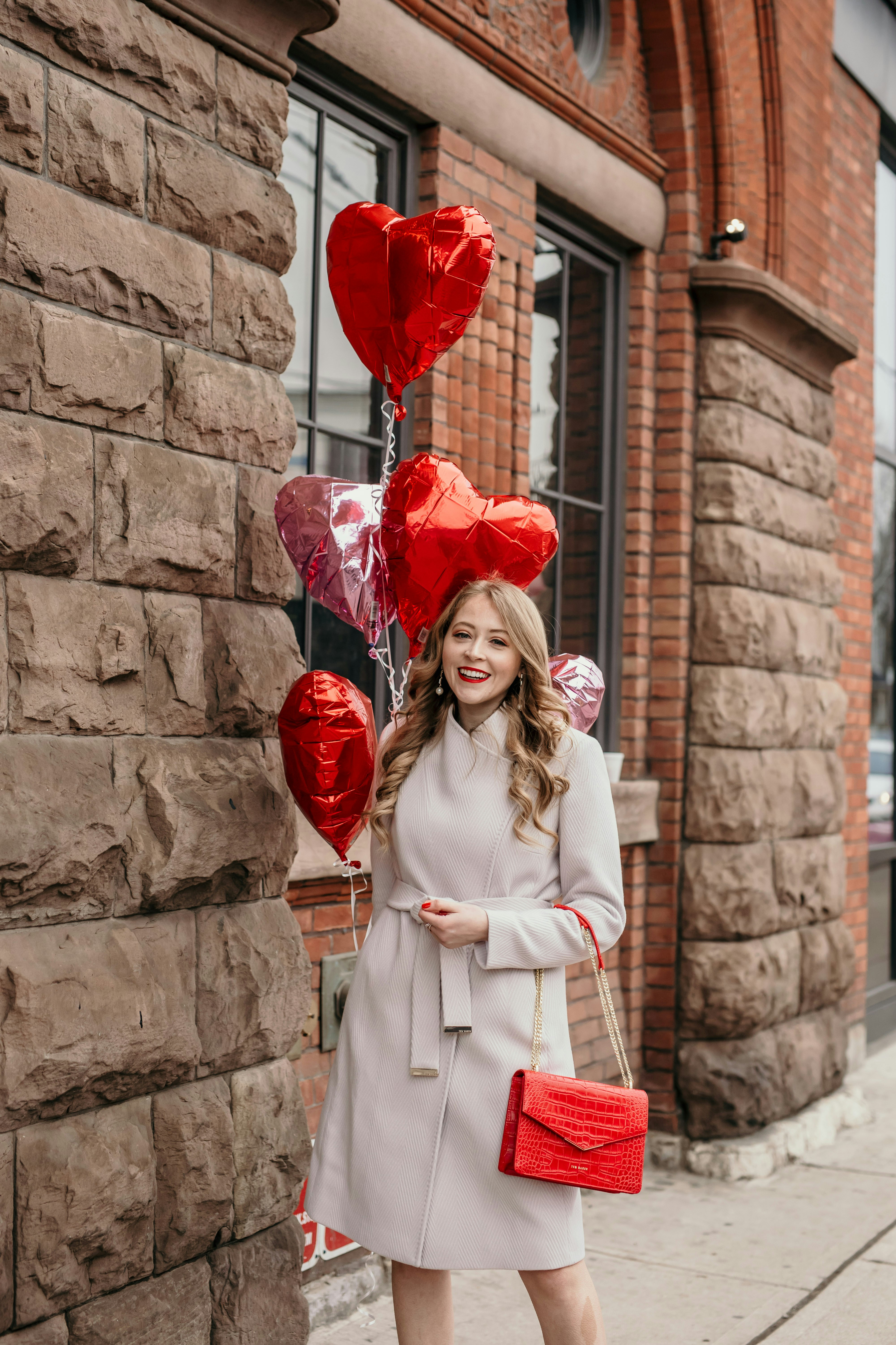 Ted Baker Beleeni Wool Wrap Coat: this chic light mauve coat is so elegant and feminine. Paired with a red croc embossed envelope bag from Ted Baker, this look is perfect for Valentine's Day!