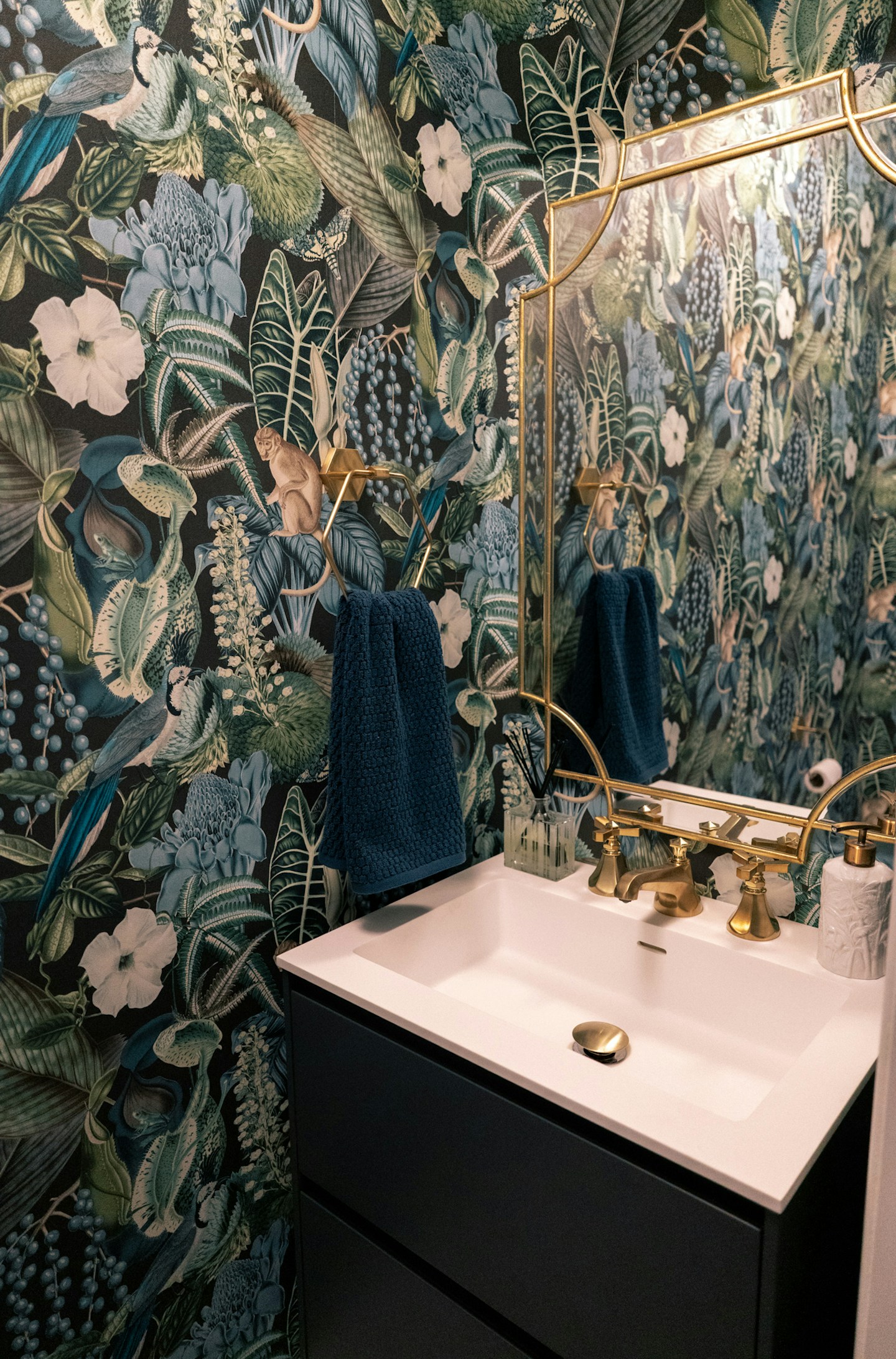 Jungle inspired Tropical Wallpaper Powder Room Makeover - sharing the process on this small bathroom renovation and wallpaper installation.